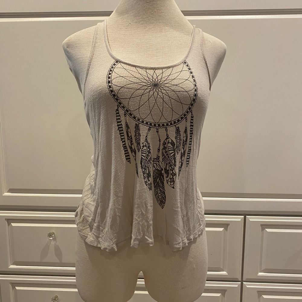Off white tank top with a dram catcher design
